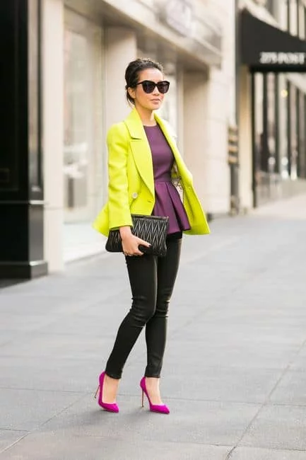 Magenta heels with yellow jacket ahd black clutch
