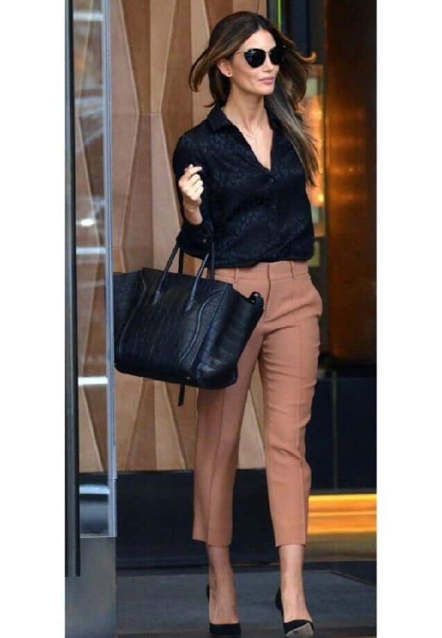 Light brown cigarette pants with black blouse and handbag