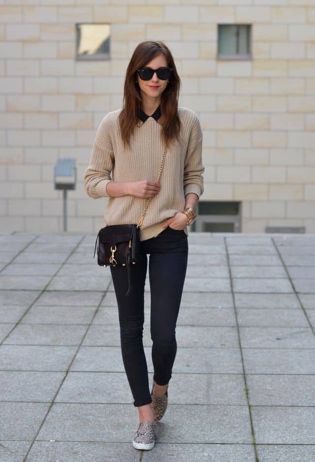 Light brown sweater with black skinnies and trainers