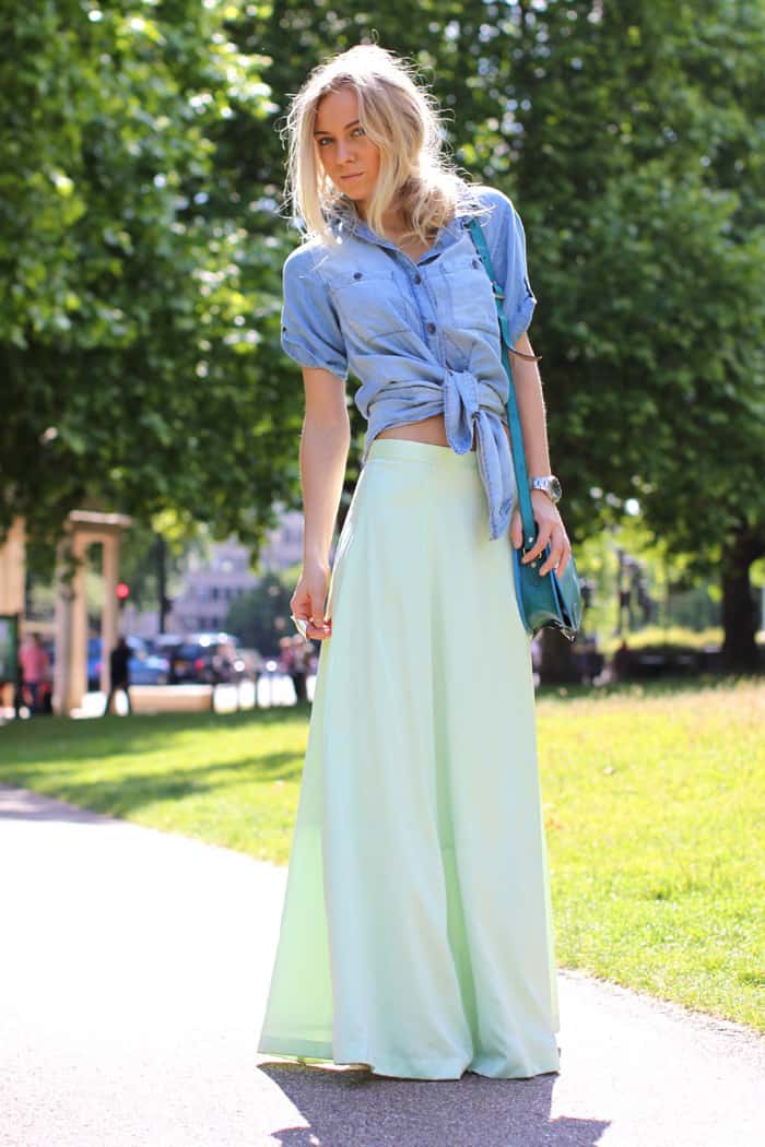 Light green maxi skirt with jeans shirt and aquamarine clutch