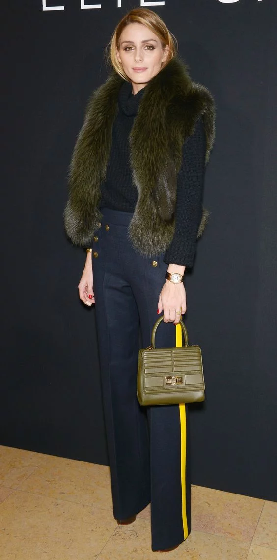 Olivia Palermo in black pants with yellow stripes
