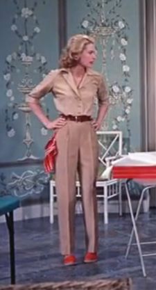 Grace Kelly in beige button up shirt
