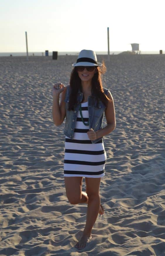 outfit with denim vest and striped mini dress